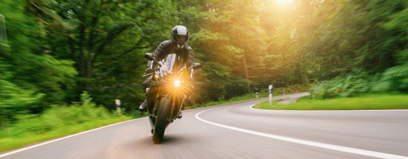 Motorbike Riding On The Forest Road. Driving On The Empty Road O